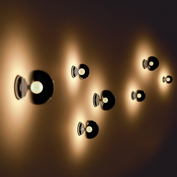 Occhio Luna scura wall luminaire on warm toned wall