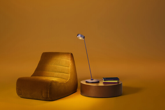 Occhio Sento tavolo table luminaire on yellow backround