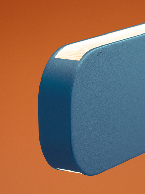 Occhio Mito volo pendant luminaire on orange backround close up