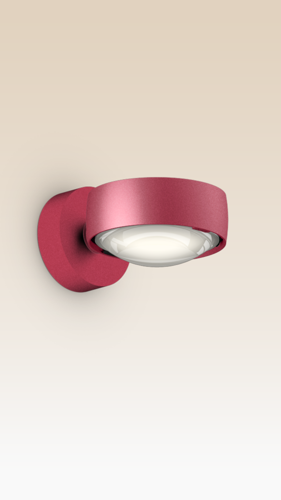 Occhio Sento verticale rosso intenso wall luminaire on beige backround
